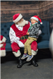 Santa Claus Talking to a Young Boy