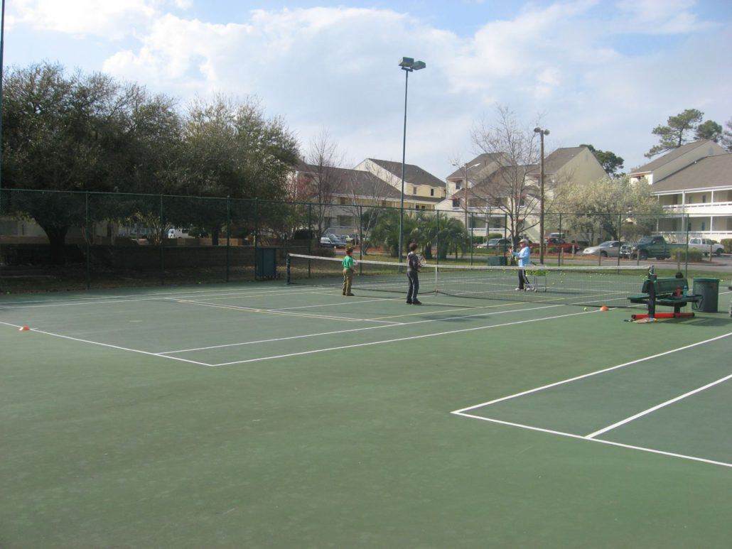 Group of People Playing Tennis